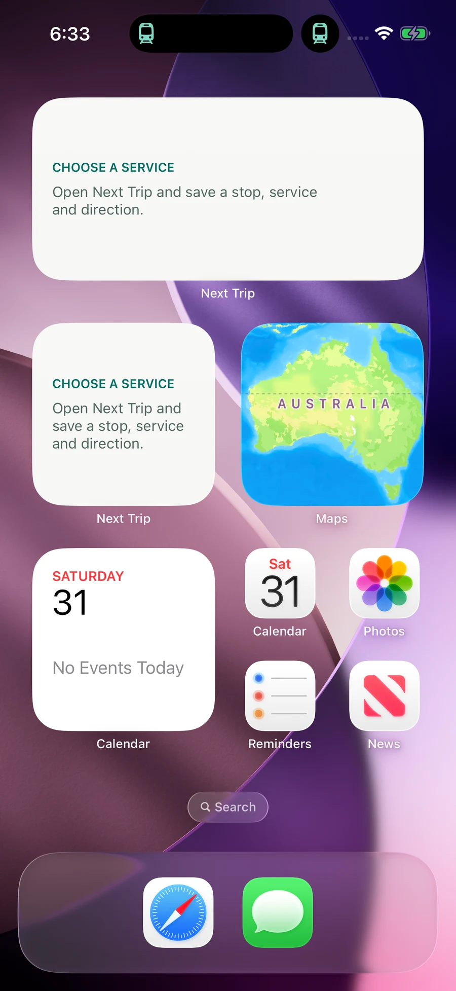 Time to Board’s minimal train icon in Dynamic Island while a second test Live Activity shares the space